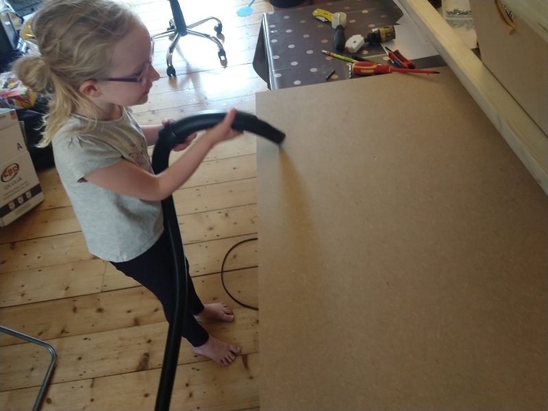 Elizabeth next to the cut backboard